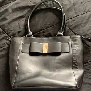 Black shoulder purse with black bow on front